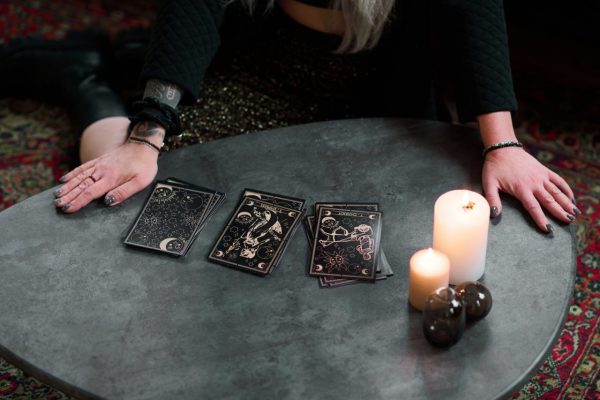unrecognizable-woman-with-tarot-cards